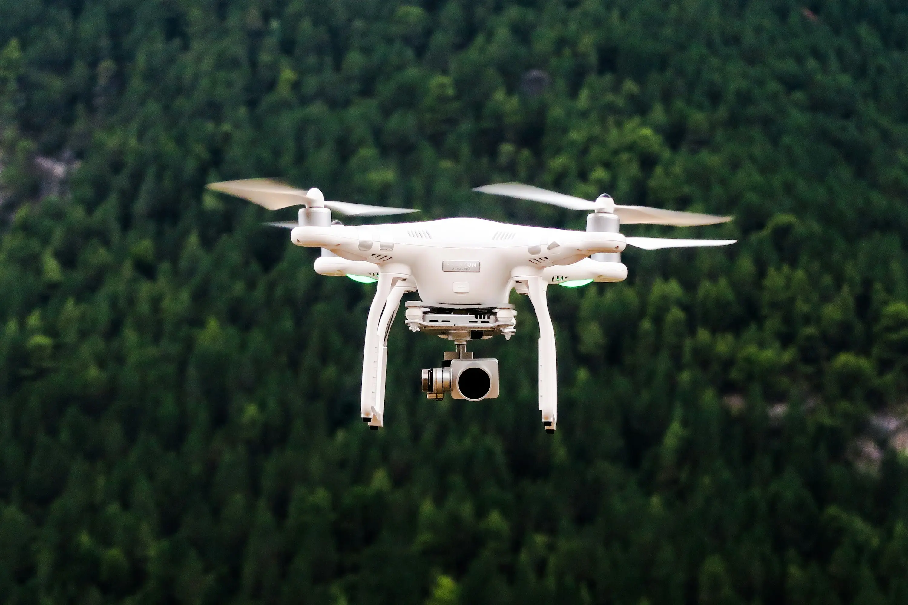 Survey drone in flight over terrain