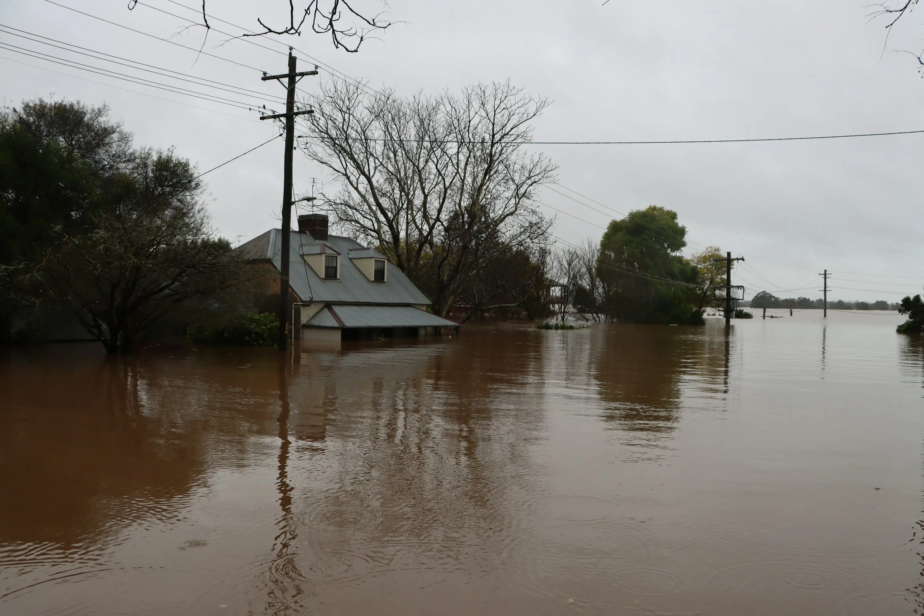 River in flood across a rural valley